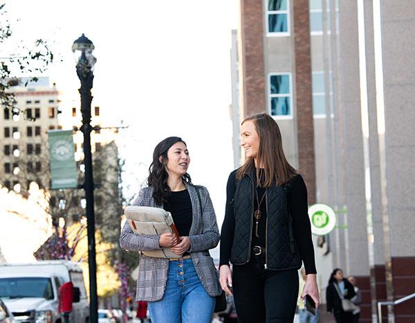 Two students walk through downtown Jacksonville.